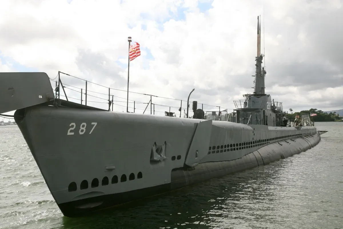 Bow and conning tower of the WWII submarine USS Bowfin (SS-287) at its museum berth in Pearl Harbor, a stop on Pearl Harbor tours from Honolulu